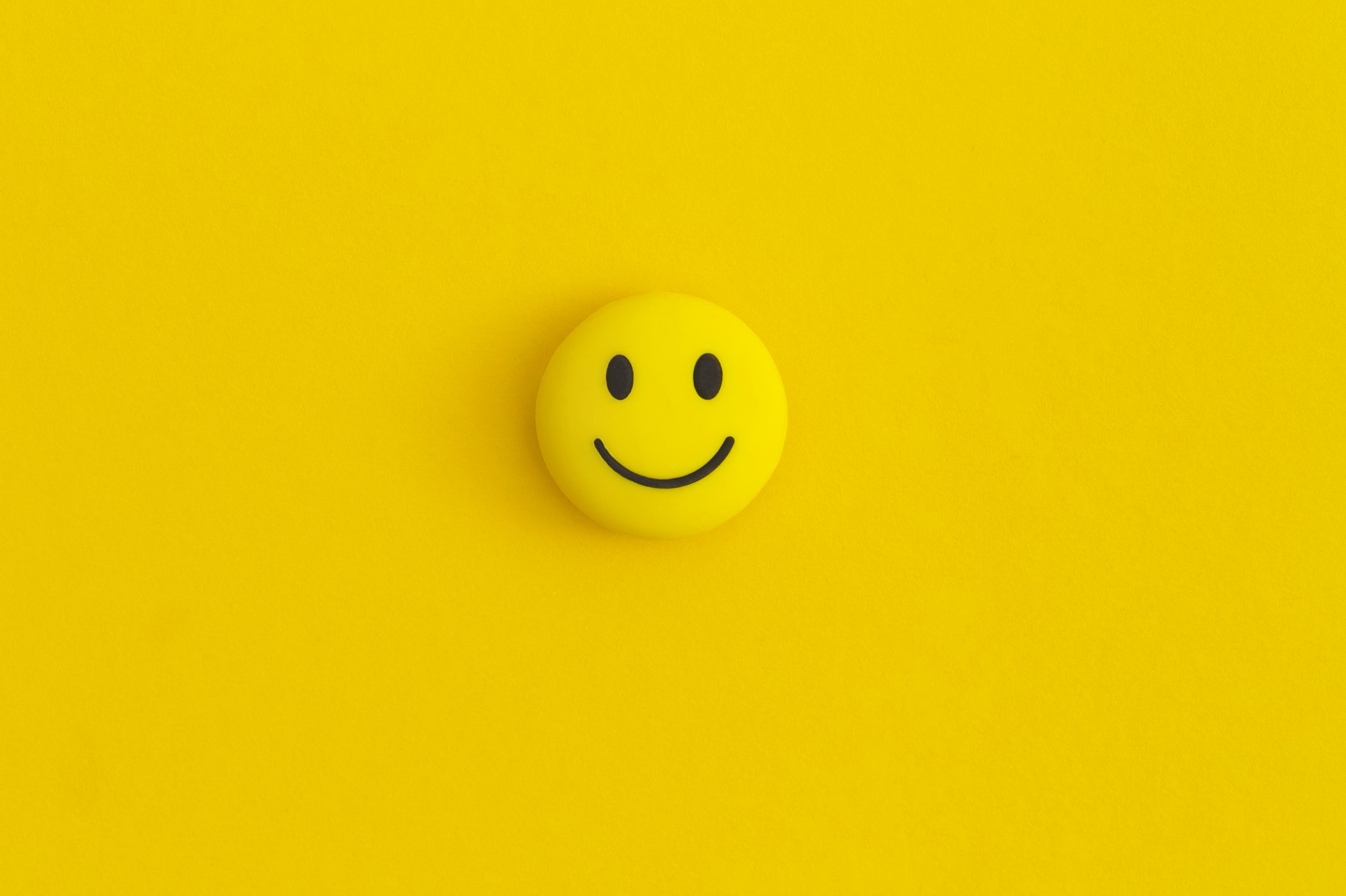 Emoticon smile on a yellow background